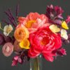 Arrangement of crepe paper flowers made with English Garden colors, featuring shades of pink, purple, yellow and cream