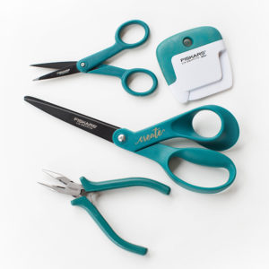 Fiskars tools featuring scissors, pliers and paper curler