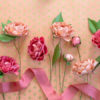 Frosted paper camellia flowers in pink and peach