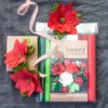 Package of Winter Garden heavy crepe paper with crepe paper poinsettias on top