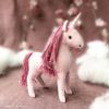 pink felt unicorn on a pink backdrop