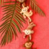four hanging felt climbing monkeys