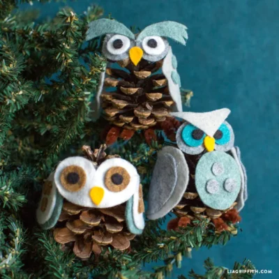 DIY felt pinecone owl ornament on a christmas tree