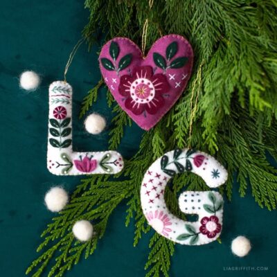 three embroidered monogram ornaments