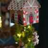 DIY felt gingerbread house on top of a tree