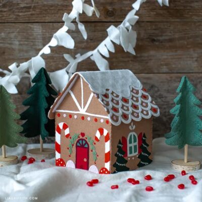 DIY felt gingerbread house in a snowy backdrop