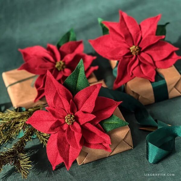 felt red poinsettia flower on gifts